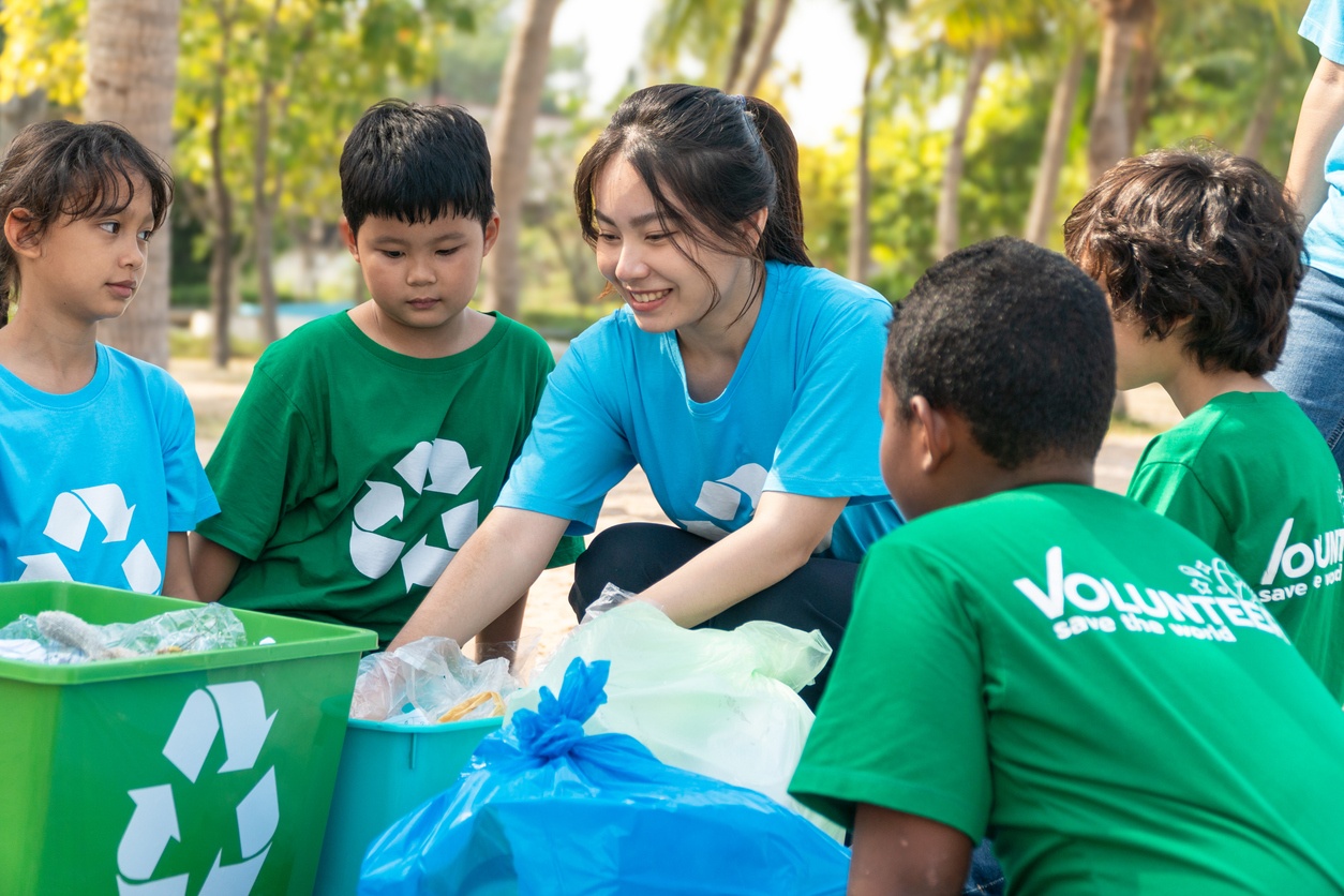women teaching group of children